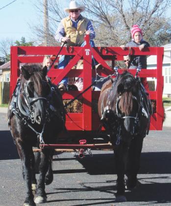 Tim Boysen and his co-pilot, Dutch Reuman, and team of horses Chip and Charley give rides to Lyman elementary students.