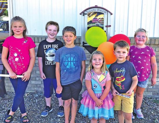 Children from the area attended the Kennebec Public Library’s Grand Re-opening and enjoyed frozen treats that were served by the Kennebec Women’s Club.