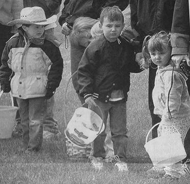 First Published in the Lyman County Herald in April 2004: Sage Mowry, Tate Wagner and his sister Kacie Wagner with buckets ready await the start of the Presho Area Chamber’s Easter Egg Hunt held Saturday at the Presho City Park. Chamber members furnished eggs for the annual hunt.