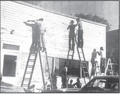 Last week’s TBT photo was published in the October 24, 1973 issue of the Herald and featured a group of young people scraping the front of the old RNA Hall located on Main Street, Presho, in preparation for painting. The building will be the new Youth and Senior Citizen Center. L-r (on ladders) Doug Halverson, Dean Reuman, and Del Rae Diedrich. Standing below, Jennifer Crane and kneeling Dona Ambur.
