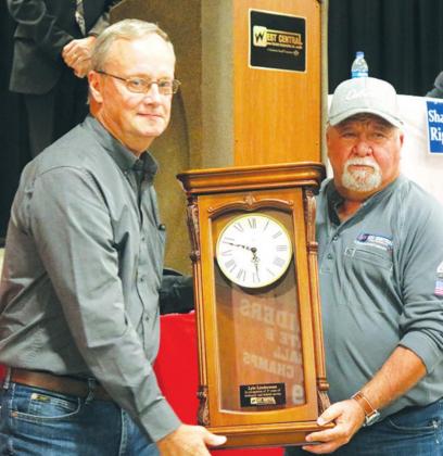 Lyle Linderman (right) of Presho received a clock from Ken Miller at the annual meeting October 6. Linderman will retire after 37 years of service with the Coop in January of 2022.