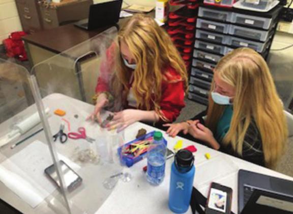 Carly Samco, left and Marina Scott make animations out of clay.