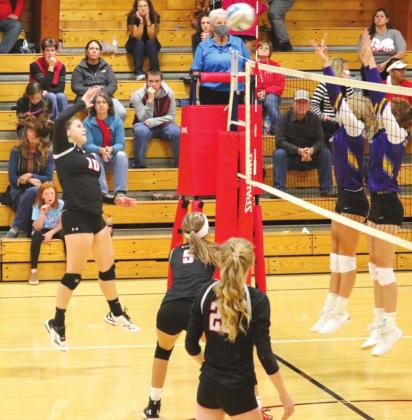 Kimberly Mousseau #10 bats the ball over the net at the home game against New Underwood Thursday evening. PHOTO BY CONNIE PENNY/LCH