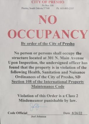 Taped to the door is the violation of the Health, Sanitation and Nuisance Ordinance of the City of Presho.