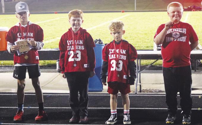 Winners in the second and third grade division in the Punt, Pass &amp; Kick event were l-r: Kane Kieffer (first) 15’7”, Will Stanley (second) 122’8”, Caleb Gerard (third) 86’7” and Jace Millard (fourth) 72’. Photo by Connie Penny/LCH