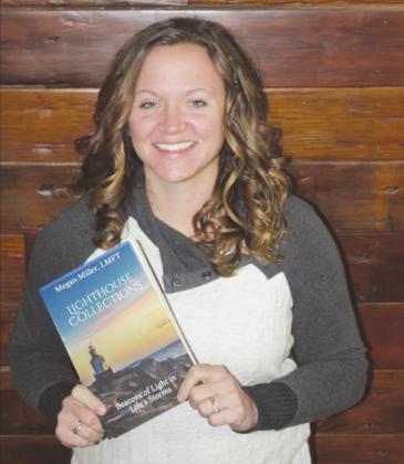 Megan Miller displays her book Beacons of Light in the Life’s Storms.