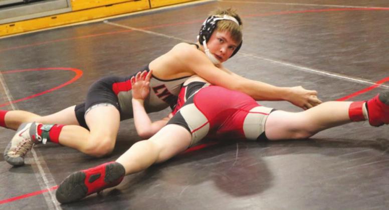 Easton Robbins works on turning his opponent to get a pin at the Mid-Dakota tournament. By Connie Penny/LCH