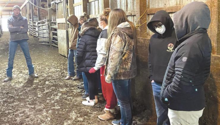 Students from Lyman High School tour the Presho Livestock Sale Barn.