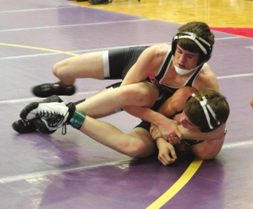 Shilo Mowry, top, puts his opponent in a cradle hold at the Stanley County Tournament.