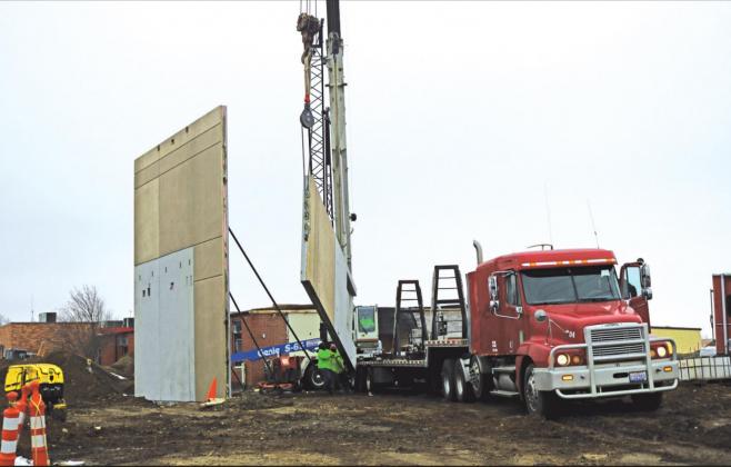 It took only four days to put up the outside walls of the new auxiliary gym at the Presho school site. The pre-fab10-foot wide by 30-foot tall concrete panels were lifted into place by a large crane.
