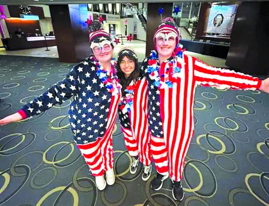 Left - right: April Hollingsworth (Wagner), Melina Shields (Lyman), and Brody Steinger (Sioux Falls-Roosevelt) get dressed up for the Stars &amp; Stripes Dance at the National JAG Conference. Photo submitted by Melina Shields, LHS