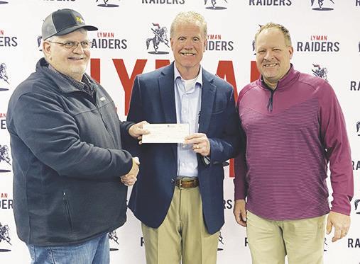 GLF member Judge Jessop, left, presents a check to Stanley Jones Trust member, Steve Hayes, center, for the Medicine Creek Golf Course Project, and Chris Long, right, Medicine Creek Golf Course Board Member.